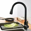 A black kitchen faucet is shown above a sink with a roll-up drying rack and lettuce. Náhľad obrázku produktu