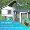A rabbit hutch with an attached run, set in a grassy outdoor environment with a hedge in the background. The image includes text overlays and graphics indicating good ventilation. Produktbild-Vorschau