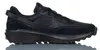 A black Nike Waffle Debut sneaker is shown from the side against a white background. Náhled obrázku produktu