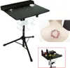 A collage of images showing a tattoo workstation, a tattoo on a person's back, and a close-up of the workstation with supplies. Náhled obrázku produktu