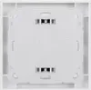 The back of a white electronic device, likely a motion sensor, mounted on a white wall plate. Produktbild-Vorschau