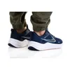 A person wearing blue Nike Downshifter 12 shoes and green pants, shown from the back. Anteprima dell’immagine prodotto