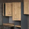 A close-up view of a modern bathroom furniture set, featuring gray matte cabinets and wood-effect doors. Produktbild-Vorschau
