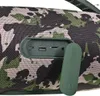A close-up view of the ports and cover of a camouflage-patterned portable speaker. Náhľad obrázku produktu