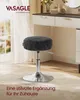 A black stool with a silver base is placed on a rug in front of a vanity table. Produktbild-Vorschau