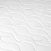 A close-up view of a white quilted mattress fabric with a wavy pattern. Produktbild-Vorschau