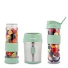 Three parts of a portable blender set are displayed against a white background. The set includes a blender base and two portable cups filled with fruit. Produktbild-Vorschau