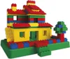 A colorful house built from toy blocks, with a small tree next to it. Podgląd zdjęcia produktu