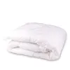A folded white duvet or comforter is shown against a white background. Náhled obrázku produktu