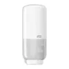 A white Tork sensor soap dispenser with a clear lower section showing the soap level. Produktbild-Vorschau