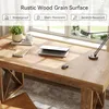 A rustic wood grain desk with a laptop, mouse, notebook, plant, and lamp, positioned near a window. Anteprima dell’immagine prodotto
