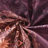 A close-up view of a crumpled piece of fabric with a mandala-like pattern. Produktbild-Vorschau
