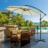 A patio umbrella shades chairs on a wooden deck overlooking a resort pool and the ocean. Voir les images du produit