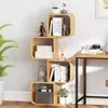 A S-shaped bookshelf filled with books and decorative items, placed against a white wall. Podgląd zdjęcia produktu