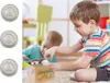 Two young children playing with a toy coin bank. Náhľad obrázku produktu