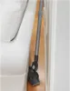 A vacuum cleaner attachment is shown cleaning the narrow space between a couch and a wall. Voir les images du produit