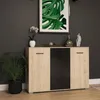 A modern sideboard with a wood-tone and black finish, decorated with a plant and decorative items, set against a dark gray wall. Náhľad obrázku produktu