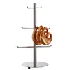 A silver mug tree with three pretzels hanging from it. Anteprima dell’immagine prodotto