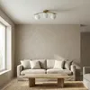 A living room scene with a sofa, coffee table, and a ceiling light. Náhľad obrázku produktu