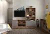 A bedroom or living room setting with a TV, shelving unit, and wardrobe. Náhľad obrázku produktu