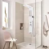 A modern bathroom with a shower system, a chair, and a window. Náhled obrázku produktu