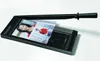 A paper cutter with a photo being cut. Produktbild-Vorschau