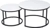 Two round nesting coffee tables with white tops and black metal frames are shown against a white background. Náhľad obrázku produktu