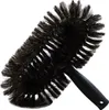 A black and brown duster brush with a black handle, isolated on a white background. Produktbild-Vorschau