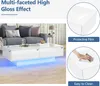 A white, high-gloss coffee table with LED lighting is shown in a living room setting next to a sofa. Voir les images du produit