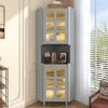 A gray corner cabinet with glass doors and gold accents is shown in a room setting. Produktbild-Vorschau