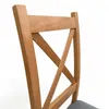 Close-up of the back of a wooden chair with an X-shaped backrest and a grey upholstered seat. Produktbild-Vorschau