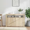 A sideboard with decorative items and a plant in a room. Voir les images du produit
