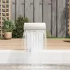 A waterfall feature is installed on the edge of a pool, with a wooden deck and fence in the background. Produktbild-Vorschau