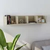 A wall-mounted shelf with various items displayed on it, including books, DVDs, decorative objects, and picture frames. Produktbild-Vorschau