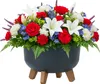 A patriotic floral arrangement in a dark gray pot with wooden legs. Podgląd zdjęcia produktu