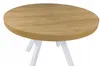 A round wooden table with white legs, shown against a white background. Náhled obrázku produktu