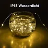 A glass bowl filled with water and LED string lights, with text overlay indicating it is waterproof. Produktbild-Vorschau