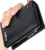 A hand holds a black leather wallet. Podgląd zdjęcia produktu