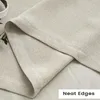 A close-up view of the fabric and stitching of a curtain. Produktbild-Vorschau
