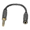 A black audio adapter cable with gold connectors against a white background. Podgląd zdjęcia produktu