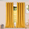 Two yellow curtains hanging on a curtain rod in front of a window. Produktbild-Vorschau