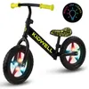 A black balance bike with yellow handlebars and seat, featuring multi-colored LED lights in the wheels and a circular graphic indicating "Multi LED Lights". Produktbild-Vorschau
