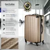 A gold suitcase is shown in a modern airport terminal. Náhled obrázku produktu