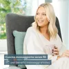 A woman is sitting in a chair, holding a mug, and looking away from the camera. There is text overlay on the bottom left of the image. Produktbild-Vorschau