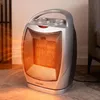 A Kalorik ceramic fan heater is shown in a living room setting, emitting heat. Podgląd zdjęcia produktu