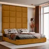 A bedroom scene featuring a bed with a large upholstered headboard. Anteprima dell’immagine prodotto