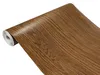 A roll of wood-grain adhesive film is shown against a white background. Produktbild-Vorschau