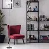 A floor lamp and a chair in a living room setting. Produktbild-Vorschau