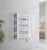 A white electric towel radiator mounted on a textured gray wall in a modern bathroom. Voir les images du produit