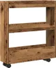 A narrow shelving unit with three shelves, made of wood-look material, with wheels at the bottom. Podgląd zdjęcia produktu